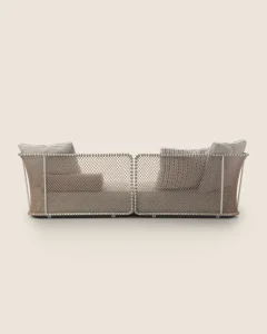 Two modular beige wicker outdoor sofas with cushions, arranged facing each other on a light background.