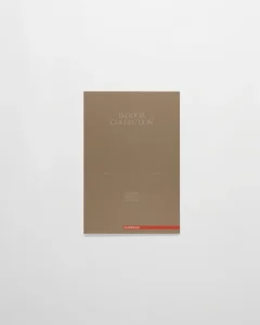 Brown brochure cover reading 'INDOOR COLLECTION' on a white surface, with a red accent stripe along the bottom edge.